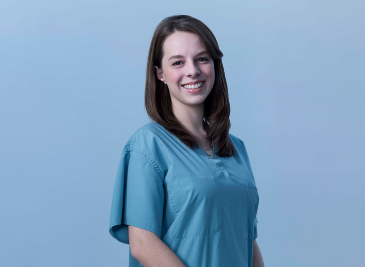 Young woman in light blue scrubs at LECOM