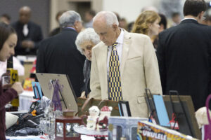 A couple looks at silent auction items during LECOM's Annual Auction and Gala.