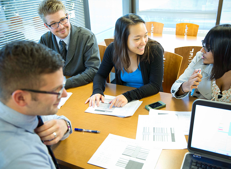 Students studying together at table in the Master of Science in Biomedical Science Program