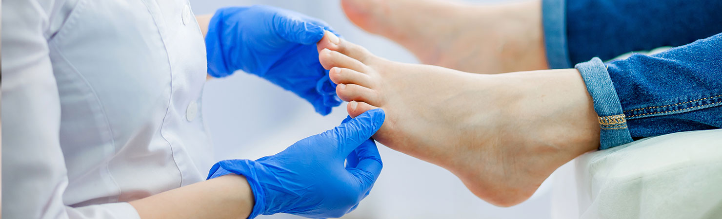Podiatry doctor examines the foot