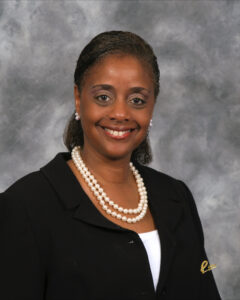 Dr. Teresa Hunter-Pettersen Portrait with gray background