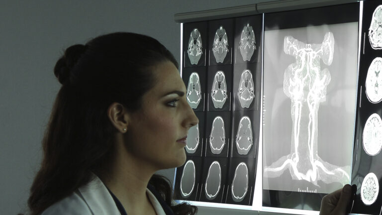 Medical student looking at xrays